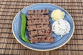 Turkish cuisine inegol meatballs. Grilled meatballs on a plate. Turkish Tekirdag or inegol Kofte with pepper, rice and mashed