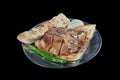 Turkish cuisine lamb ribs on pita bread. Tandoori style lamb chops and spiked pita served with green peppers and onions