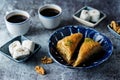 Turkish delight. Baklava and coconut lukum with cups of coffee