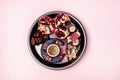 Turkish Delight Turkish Coffee Date Fruit and Garnet on Black Round Tray Pink Background Top View Ramadan Royalty Free Stock Photo