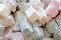 Turkish delight colorful pieces in powdered sugar. Rahat lokum traditional Turkish sweets, Turkey. Close up image