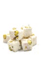 Turkish Delight Double Roasted Sultan Wick with Coconut Flakes, isolated on a white background. Close-up pistachio Turkish delight Royalty Free Stock Photo