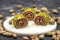 Turkish Delight with Grated Pistachio. Turkish delight with pistachio on a dark background. Royalty Free Stock Photo