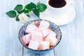 Turkish delight or lokum confection rose and lemon flavored with cup of coffee and rose, horizontal Royalty Free Stock Photo