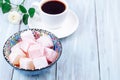 Turkish delight or lokum confection rose and lemon flavored with cup of coffee and rose, copy space Royalty Free Stock Photo