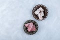 Turkish Delight or lokum on metal service plates, top view. Oriental Sweets with pomegranate, ginger and rose flavor. Gelatin