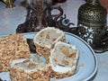 Turkish delight with nuts beside a coffee cup - fildjan and a glass for tea - armuda Royalty Free Stock Photo