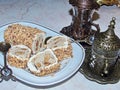 Turkish delight with nuts beside a coffee cup - fildjan and a glass for tea - armuda Royalty Free Stock Photo