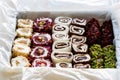 Turkish delight with nuts, pistachios, coconut, chocolate and rose leaves in the box. Rahat lokum, traditional Turkish sweets.