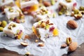 turkish delight pieces with walnut filling, close-up, on parchment paper