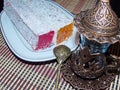 Turkish delight from rose petals and a glass for tea - Armudu, armuda, bogmaly. Oriental sweets. Natural and healthy food. Royalty Free Stock Photo