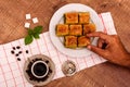 Turkish delights - baklava traditional sweets with turkish coffee, sugar the view from the top on wooden table and white Royalty Free Stock Photo