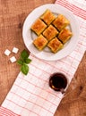 Turkish delights - baklava traditional sweets with turkish tea, sugar the view from the top on wooden table and white Royalty Free Stock Photo