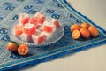 Turkish Delights and Fruits with Kumquat flavour on a Blue Vintage Tablecloth