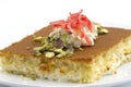 Turkish dessert kunefe, kunafa, kadayif with pistachio powder and cheese