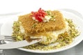 Turkish dessert kunefe, kunafa, kadayif with pistachio powder and cheese