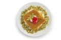 Turkish dessert kunefe, kunafa, kadayif with pistachio powder and cheese