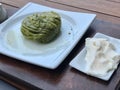 Turkish Dessert Pistachio Roll with Ice Cream served at Restaurant / Fistikli Dolama or Sarma Baklava / Baklava Royalty Free Stock Photo