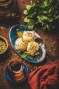 Turkish dessert semolina helva with pistachio and mint leaves