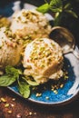 Turkish dessert semolina helva with pistachio and mint on plate