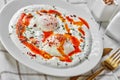 Turkish eggs with greek yogurt and aleppo pepper