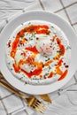 Turkish eggs with greek yogurt and aleppo pepper