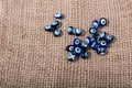 Turkish evil eye beads on canvas texture Royalty Free Stock Photo