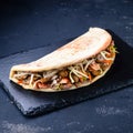 Turkish fast food - mushrooms and chicken in pita bread