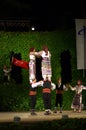 Turkish female dancers upright on men shoulders