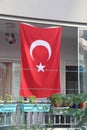 Turkish flag on the balcony of a residential building, Turkey, August 2022.