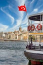 Turkish flag on a ferry boat, Eminonu ferry terminal, Istanbul, with Galata Tower, and Galata Bridge in the background