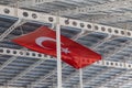 Turkish flag or flag of Turkey waving on building against blue sky in Istanbul. Space for text Royalty Free Stock Photo