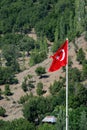 The Turkish Flag flying in a mountain village in Turkey Royalty Free Stock Photo