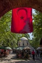A Turkish flag hangs over the entrance to Koza Hani (Cocoon Caravanserai) in Bursa, Turkey.