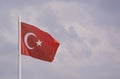 Turkish flag isolated on sky background moving in the wind. State symbol of Turkey Royalty Free Stock Photo