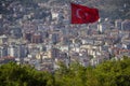 Turkish flag over the city. Alanya, Turkey. Wonderful country. At home from a height. Roofs of buildings Royalty Free Stock Photo