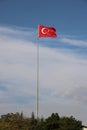 Turkish flag, flag pole, blue sky. Royalty Free Stock Photo