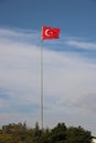 Turkish flag, flag pole, blue sky. Royalty Free Stock Photo
