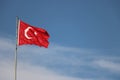 Turkish flag, flag pole, blue sky. Royalty Free Stock Photo