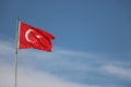 Turkish flag, flag pole, blue sky. Royalty Free Stock Photo
