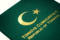 A Turkish Flag sign and Republic of Turkey text in a green Turkish Special Passport