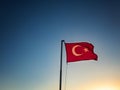 Turkish flag is waving against sky at the background Royalty Free Stock Photo