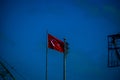 Turkish flag waving in blue sky. Royalty Free Stock Photo