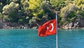 Turkish flag waving on the bow of the yacht on a boat tour Royalty Free Stock Photo