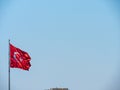 Turkish flag waving front of blue sky Royalty Free Stock Photo