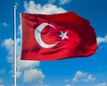 Turkish flag waving over blue sky Royalty Free Stock Photo