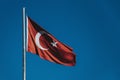 Turkish flag waving in the wind with blue sky background Royalty Free Stock Photo