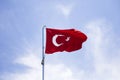 Turkish flag waving in the wind at blue sky Royalty Free Stock Photo