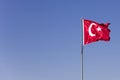 Turkish flag waving in the wind at blue sky Royalty Free Stock Photo