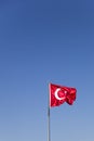 Turkish flag waving in the wind at blue sky Royalty Free Stock Photo